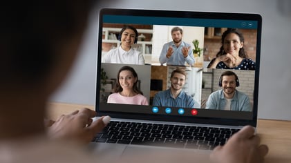 laptop screen with 6 people on a zoom meeting