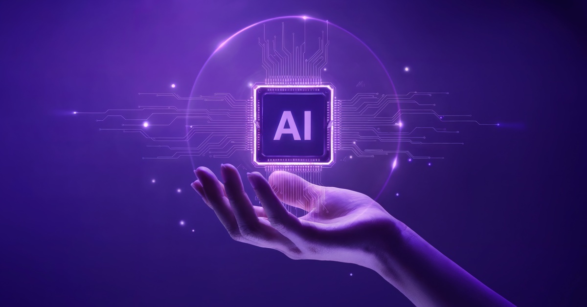 A hand holding a graphic of a computer chip with the word "AI" on it. Everything is glowing purple.