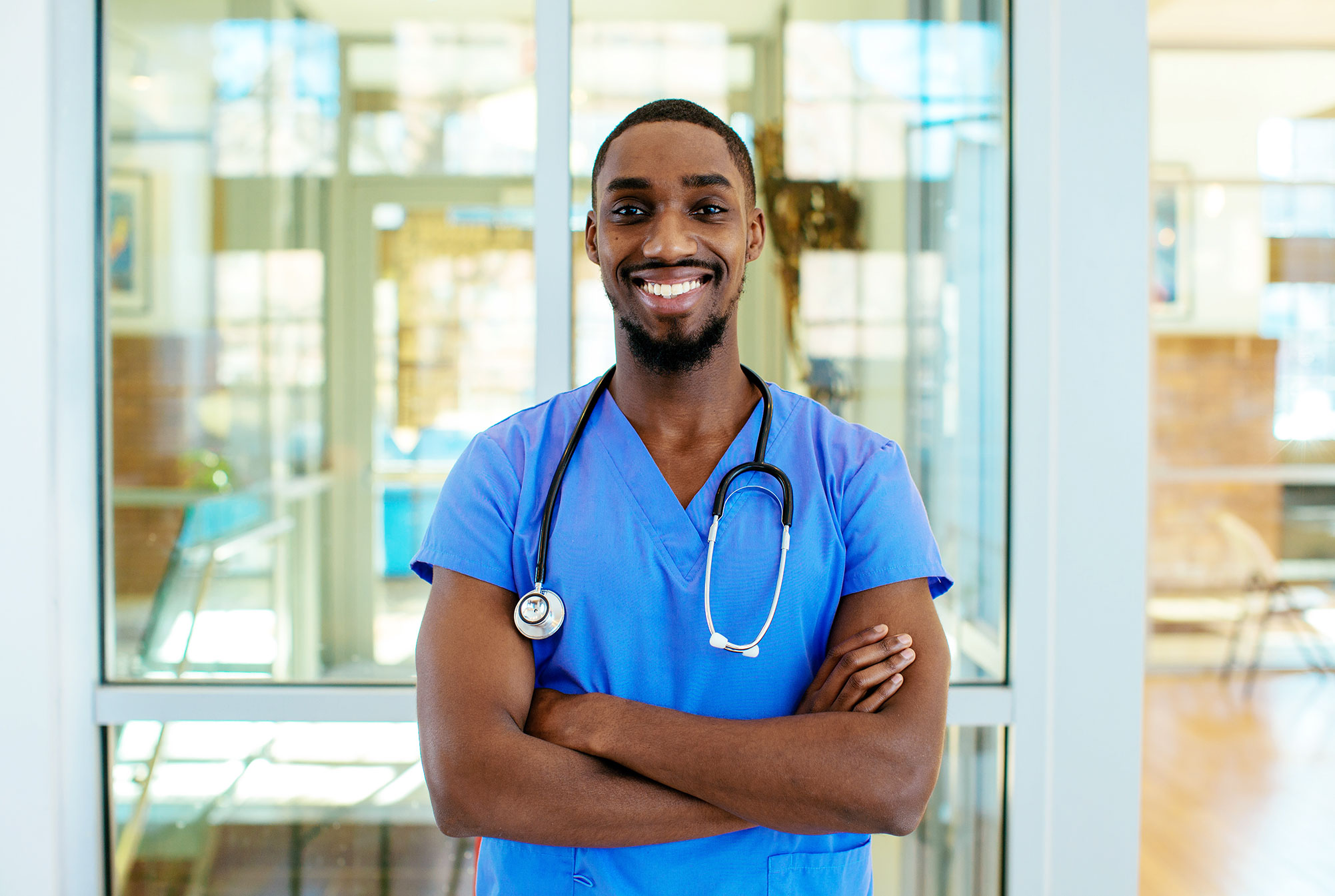 Black-male-nurse-smiling-with-arms-crossed
